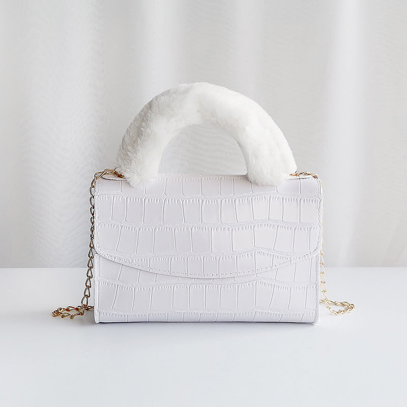 Modische Handtasche aus Plüsch mit Steinmuster