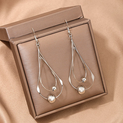 Female French Style Temperament Hollow Water Drops Tassel Long Earrings