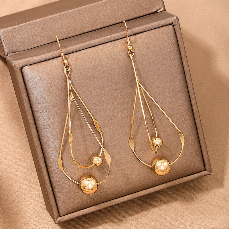 Female French Style Temperament Hollow Water Drops Tassel Long Earrings